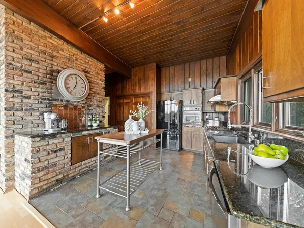 a dining room with furniture and a clock