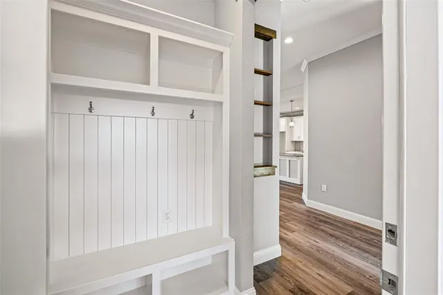 a view of front door with wooden floor