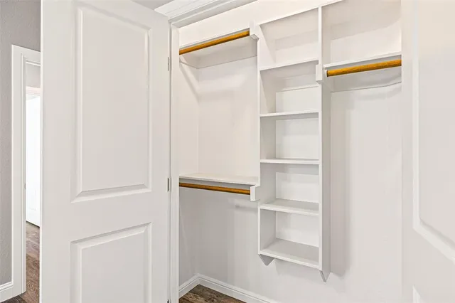 a view of an empty walk in closet
