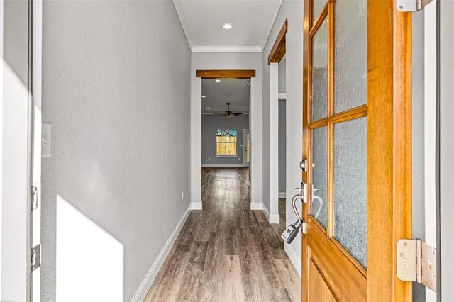 a view of gallery with wooden floor