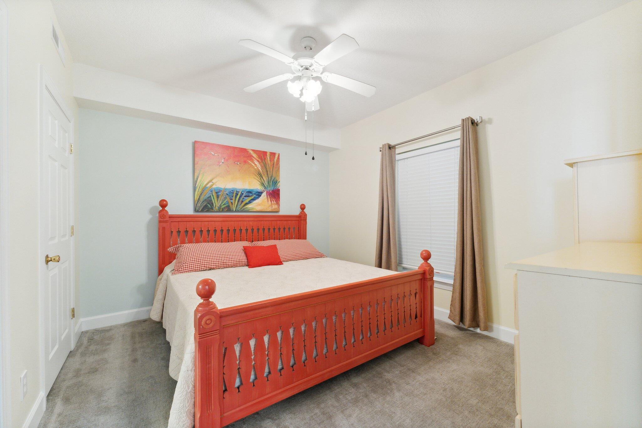 17545 Front Beach Road, Unit 2103 Panama City Beach, FL 32413 - Photo 13 of 56 a bedroom with a bed and a chandelier