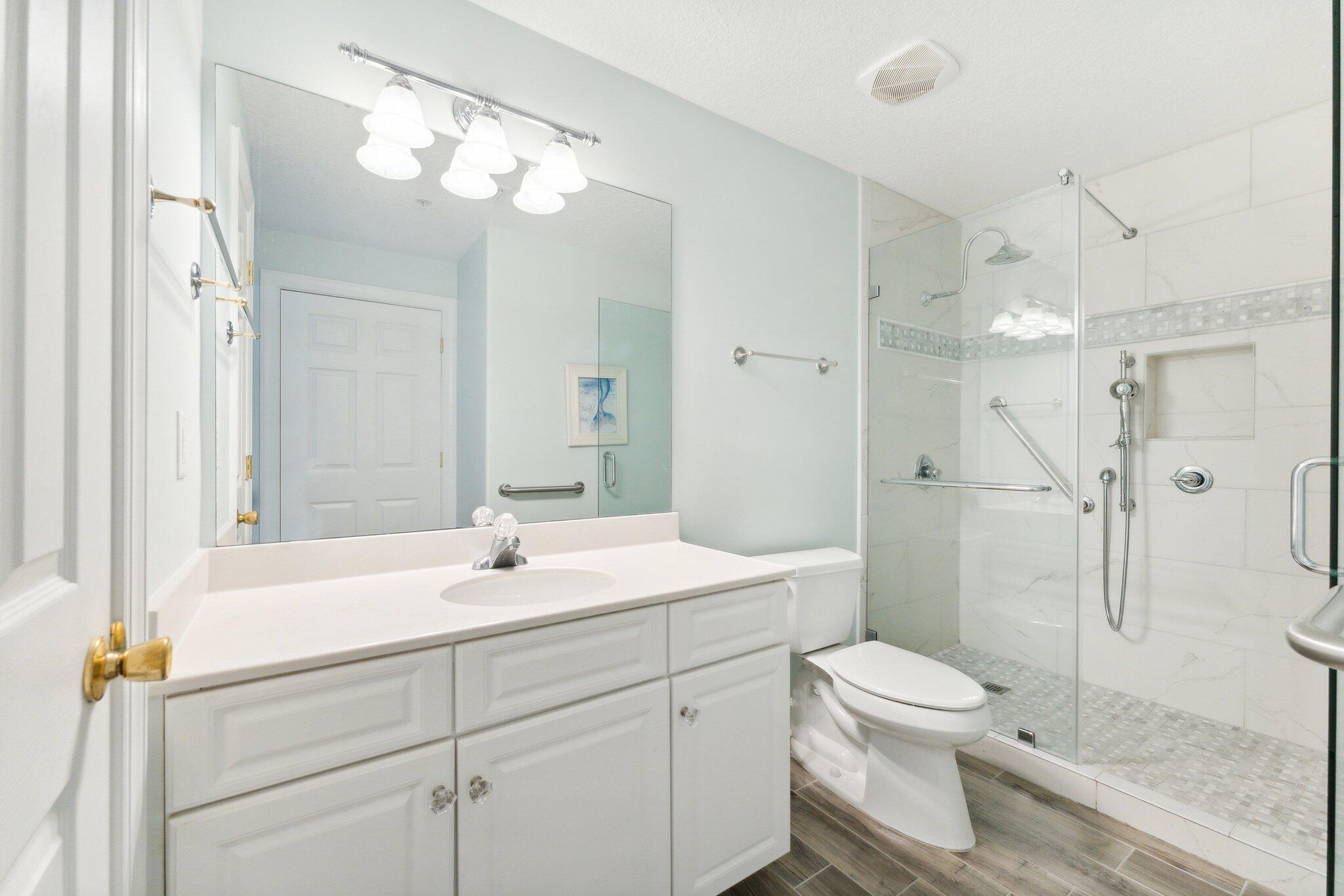 17545 Front Beach Road, Unit 2103 Panama City Beach, FL 32413 - Photo 15 of 56 a bathroom with a sink a toilet and shower