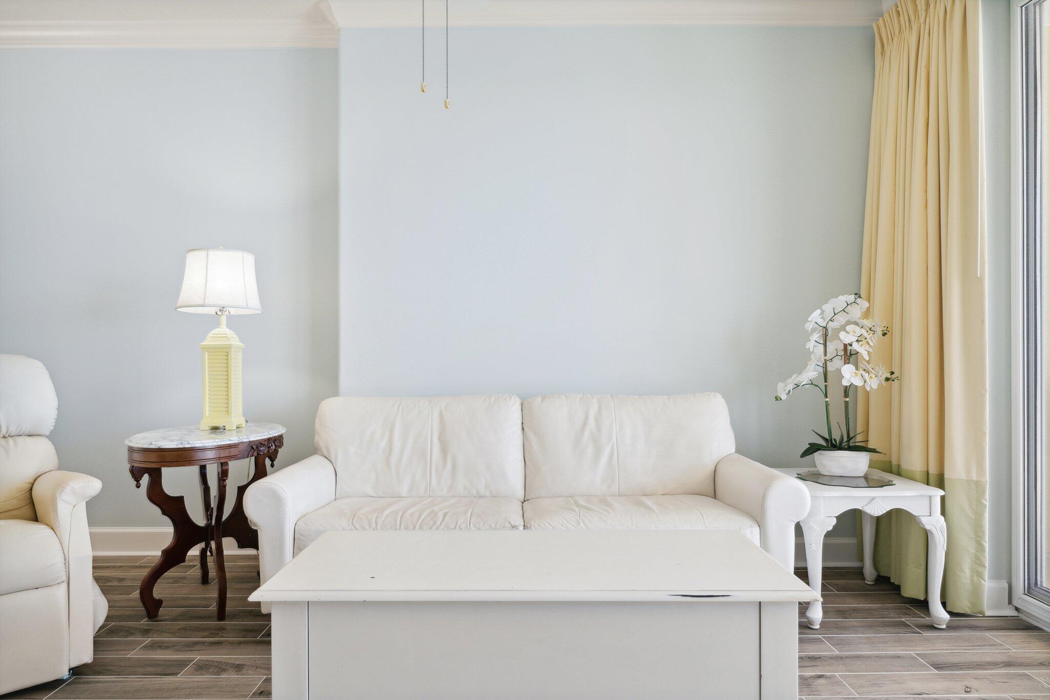 17545 Front Beach Road, Unit 2103 Panama City Beach, FL 32413 - Photo 20 of 56 a living room with furniture and a lamp