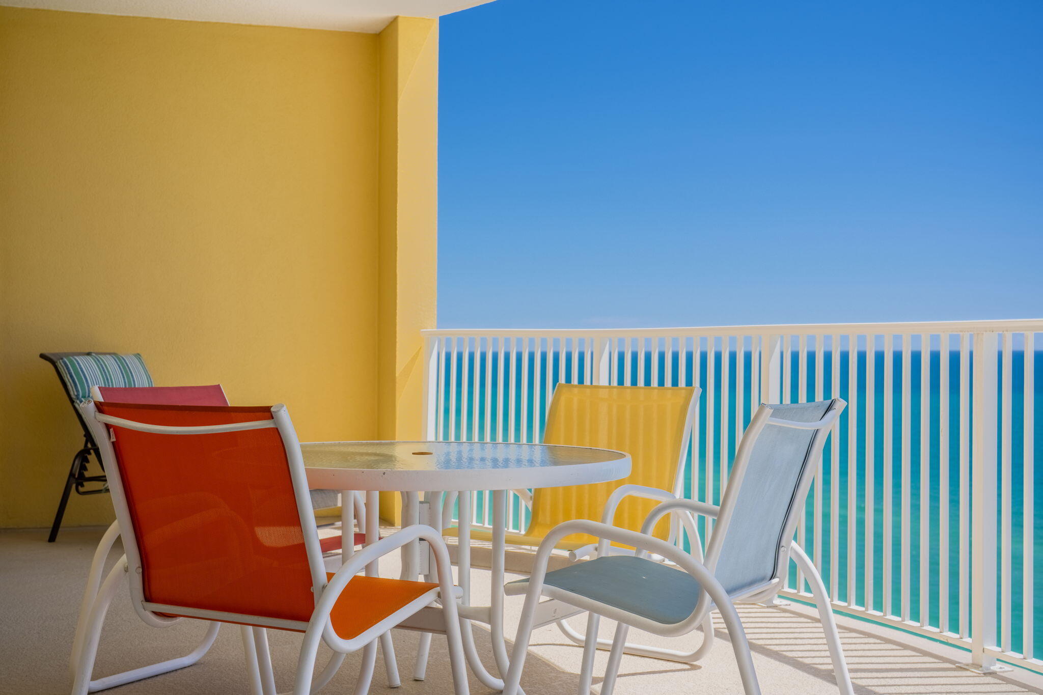 17545 Front Beach Road, Unit 2103 Panama City Beach, FL 32413 - Photo 2 of 56 a view of a chair and table in the balcony