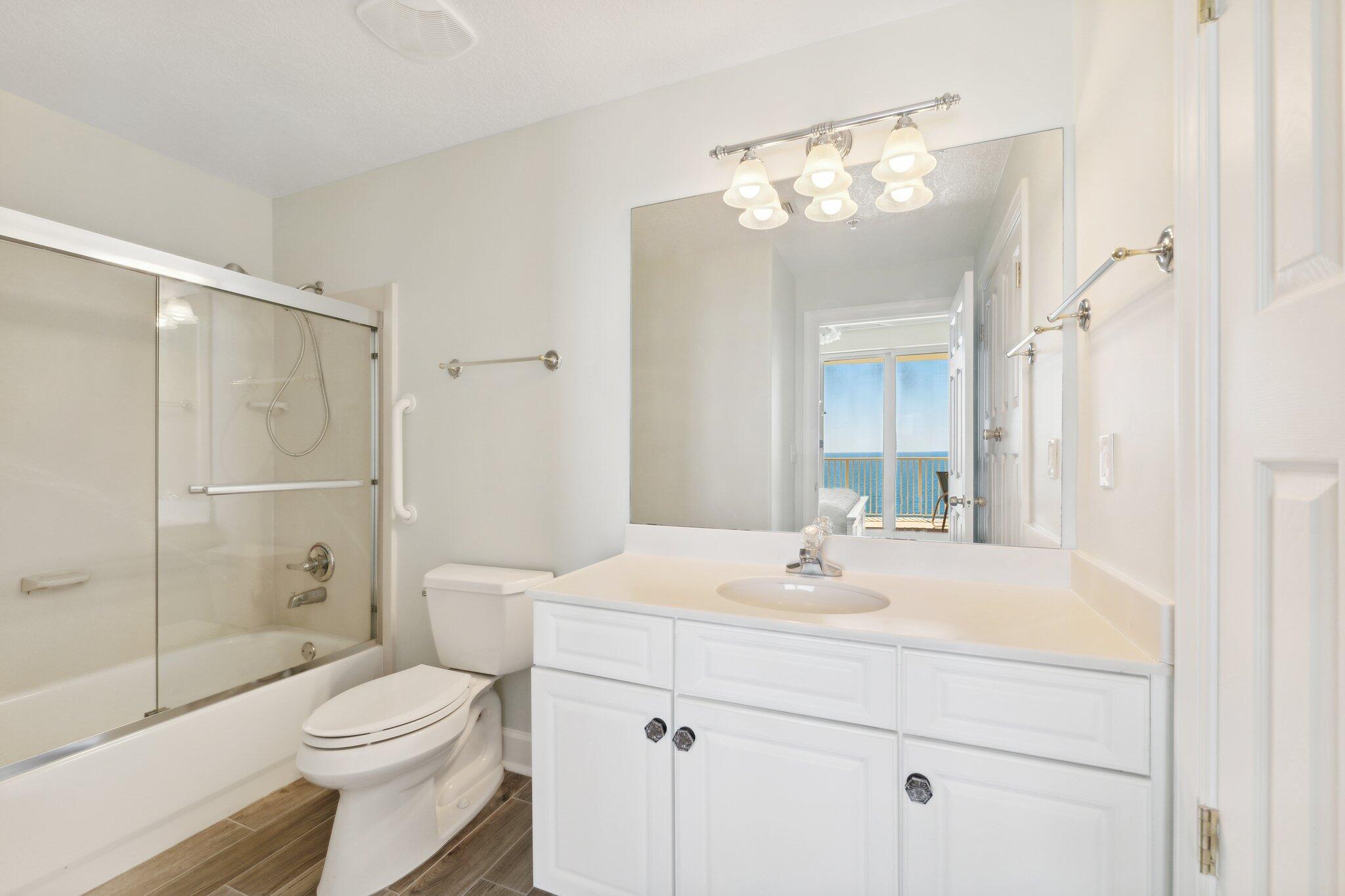 17545 Front Beach Road, Unit 2103 Panama City Beach, FL 32413 - Photo 25 of 56 a bathroom with a sink a toilet and shower