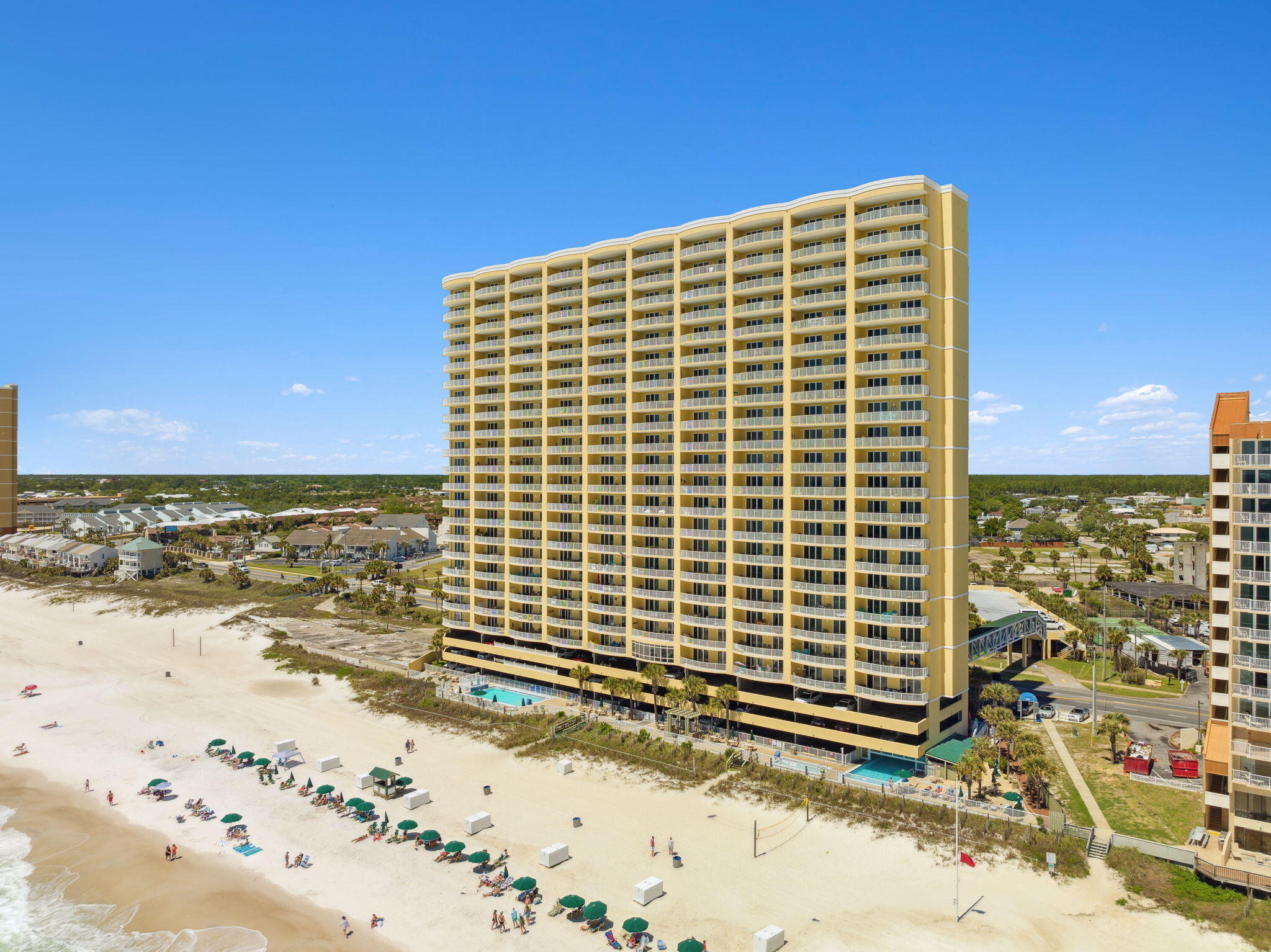 17545 Front Beach Road, Unit 2103 Panama City Beach, FL 32413 - Photo 47 of 56 a front view of a building with a yard