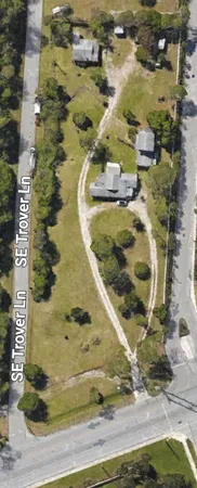 a view of yard with swimming pool and green space