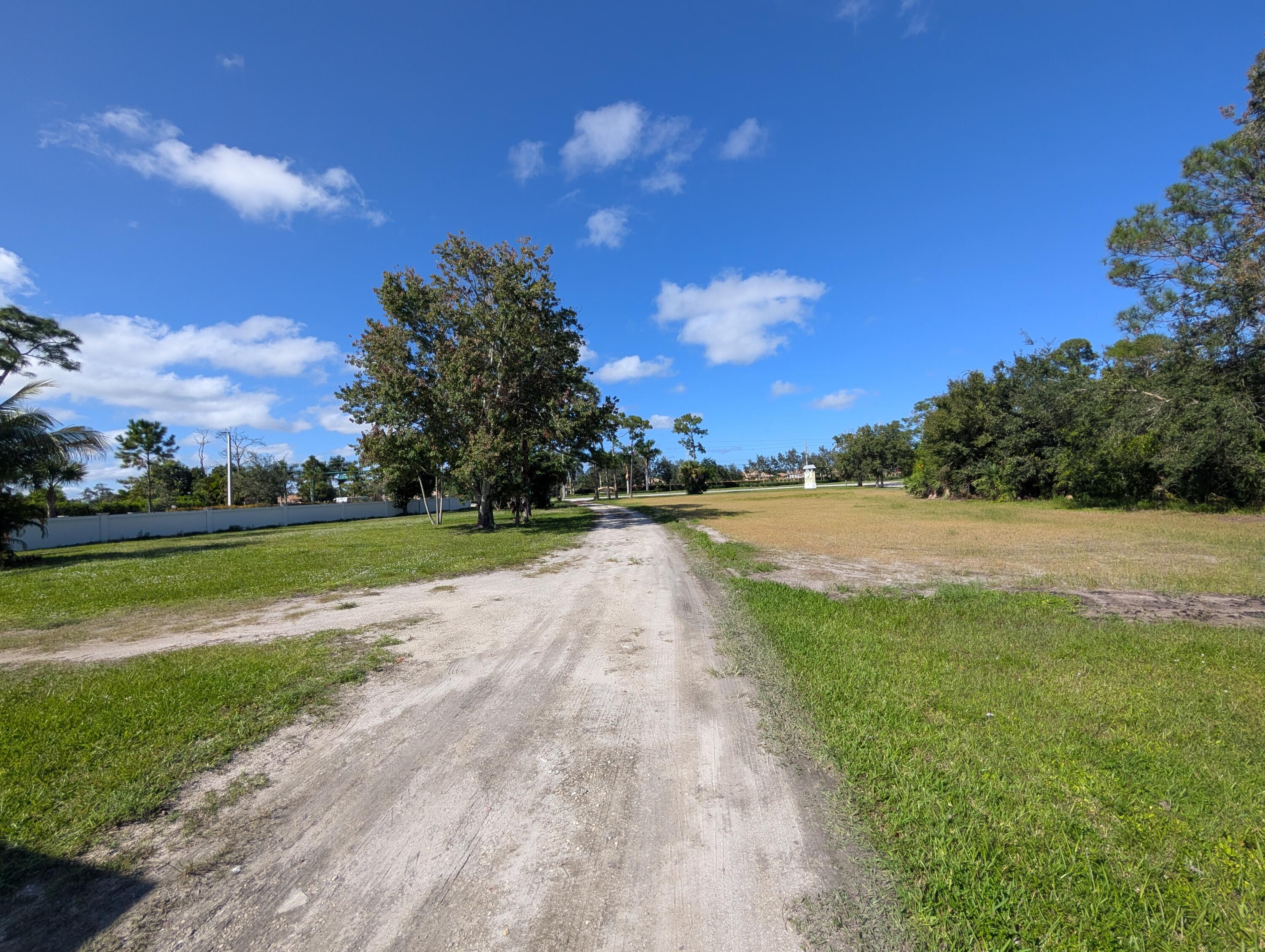 1500 Southeast Cove Road Stuart, FL 34997 - Photo 27 of 28 a view of yard with swimming pool and green space