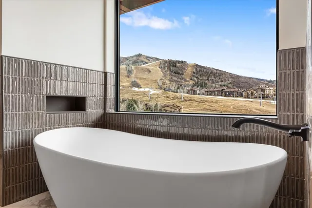 a white bath tub sitting in a bathroom