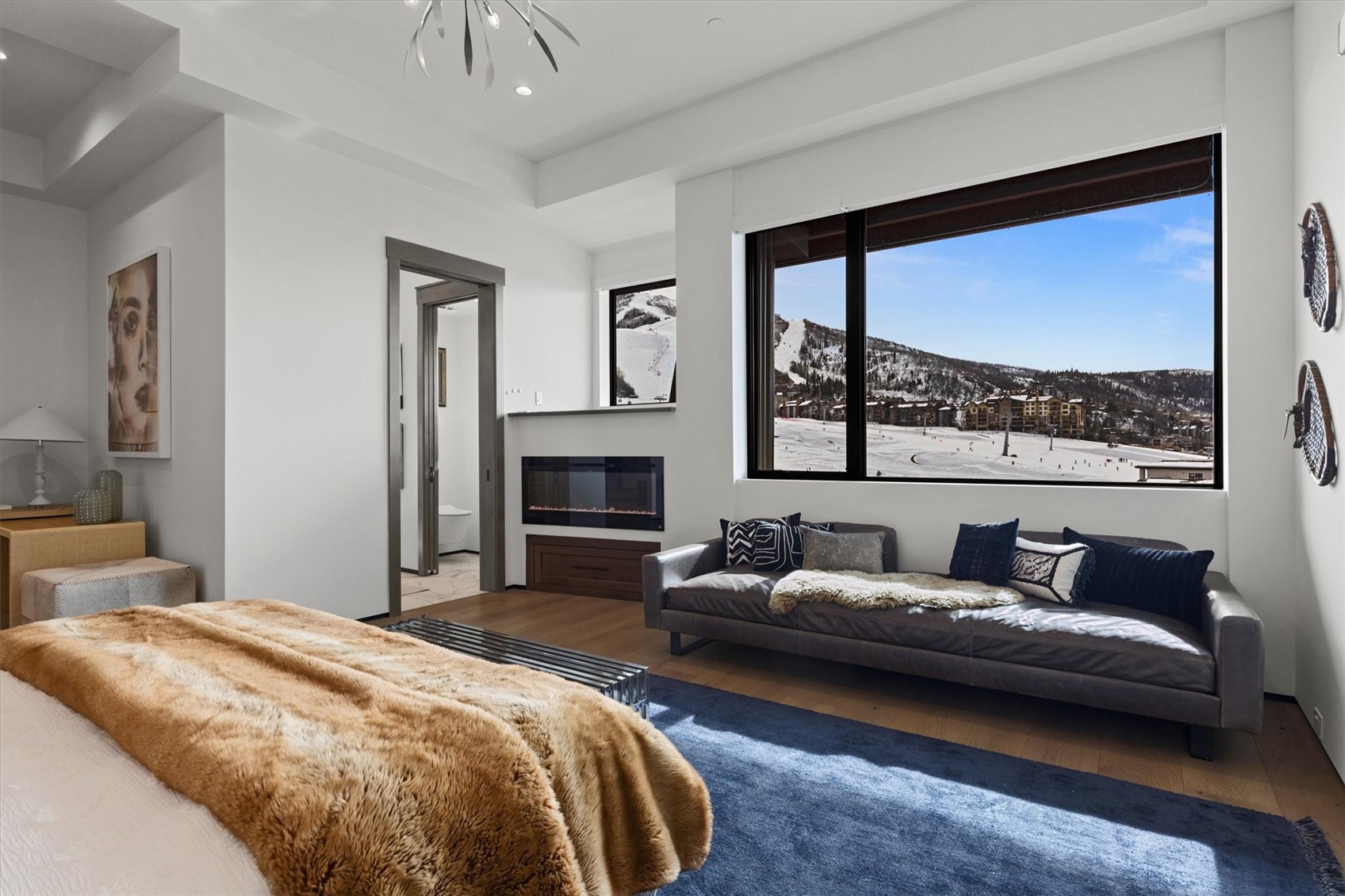 1855 Burgess Creek Road, Unit 3 Steamboat Springs, CO 80487 - Photo 28 of 50 a bedroom with a large bed and a large window