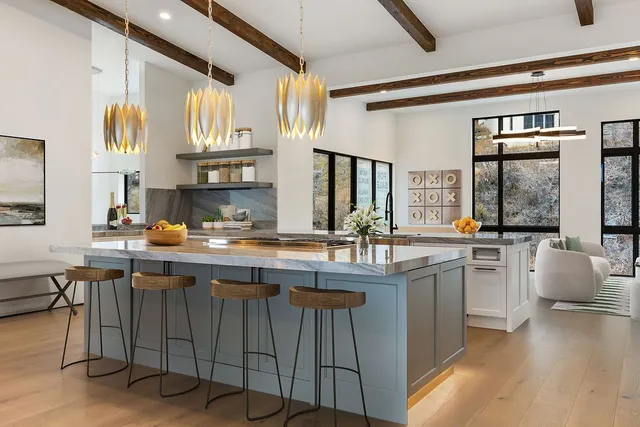 a kitchen with stainless steel appliances granite countertop a sink and cabinets