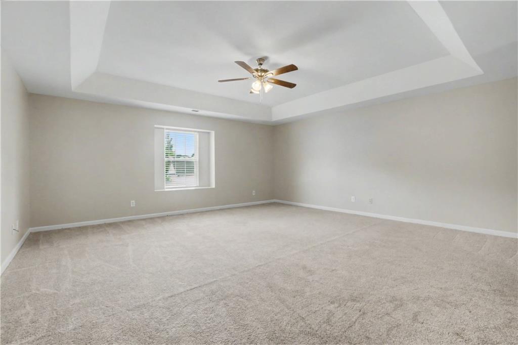 375 Walton View Fairburn, GA 30213 - Photo 23 of 38 an empty room with a window and a fan