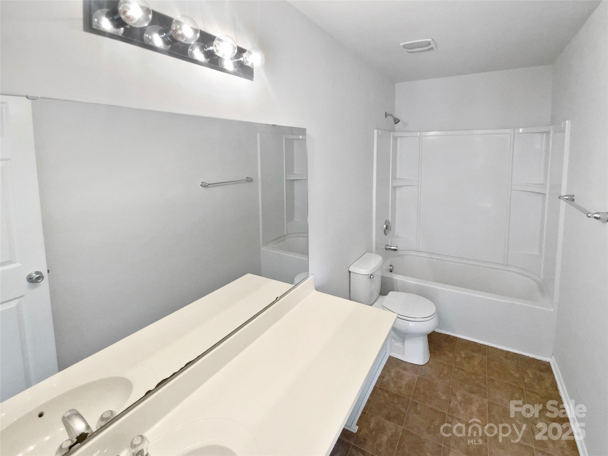 4418 Kiddle Lane Monroe, NC 28110 - Photo 15 of 19 a bathroom with a toilet and a shower