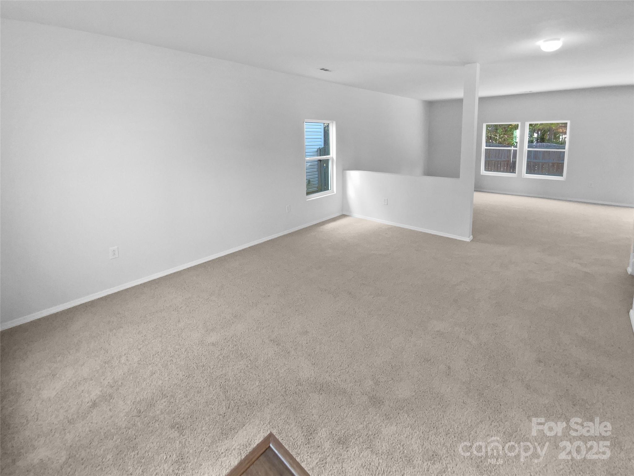 4418 Kiddle Lane Monroe, NC 28110 - Photo 7 of 19 a view of empty room with windows