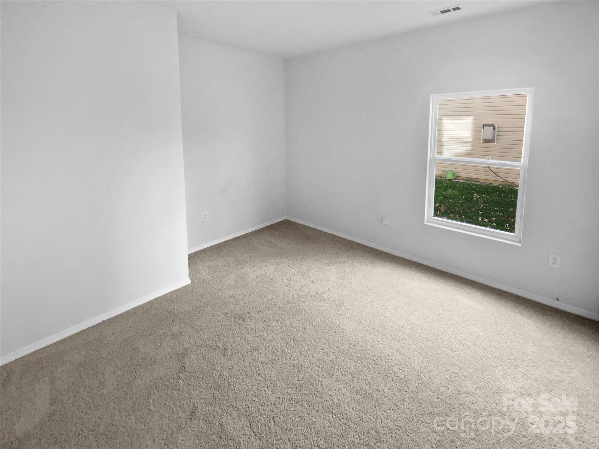 4418 Kiddle Lane Monroe, NC 28110 - Photo 8 of 19 an empty room with a window