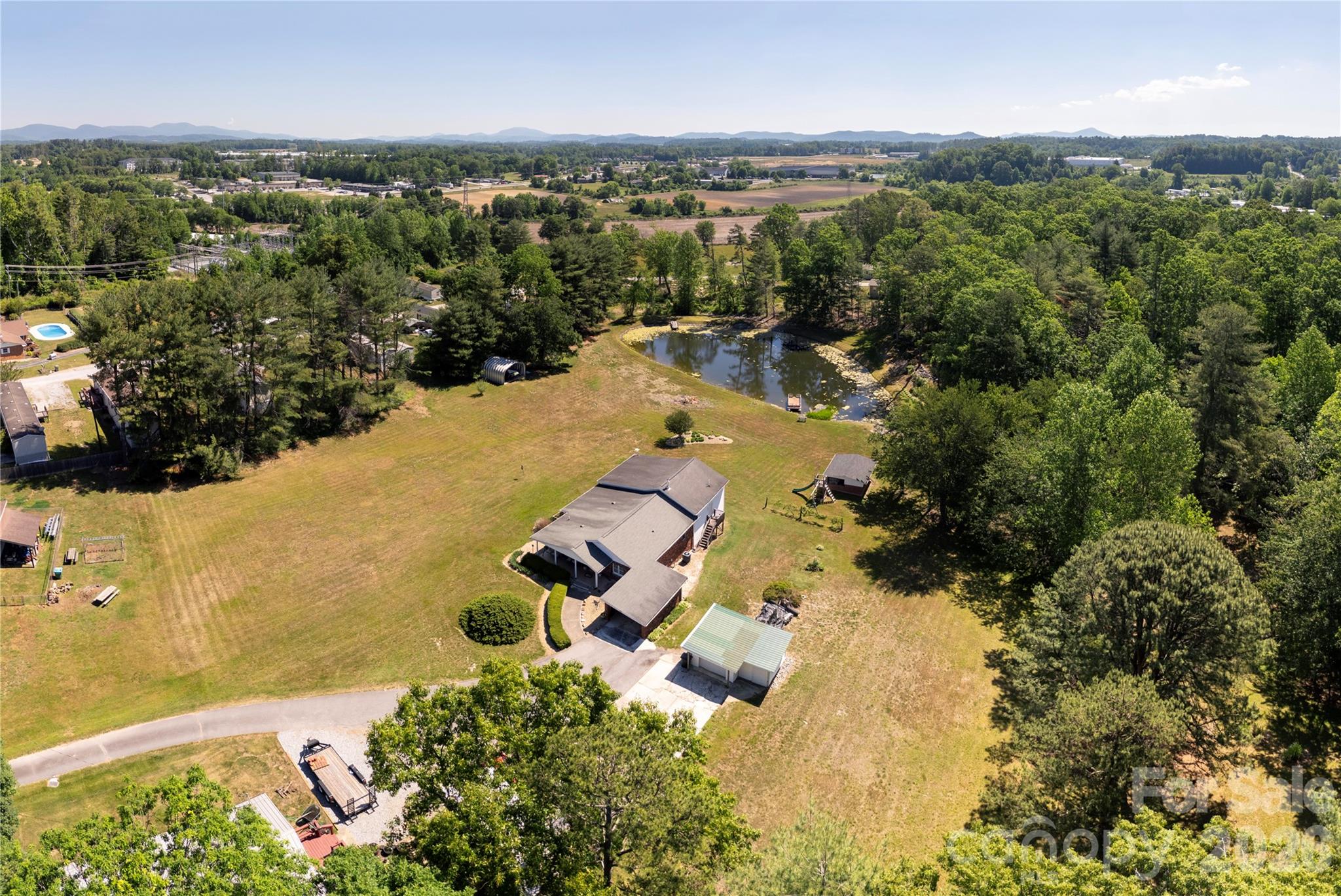 231 Allen Road East Flat Rock, NC 28726 - Photo 40 of 42 an aerial view of residential houses with outdoor space