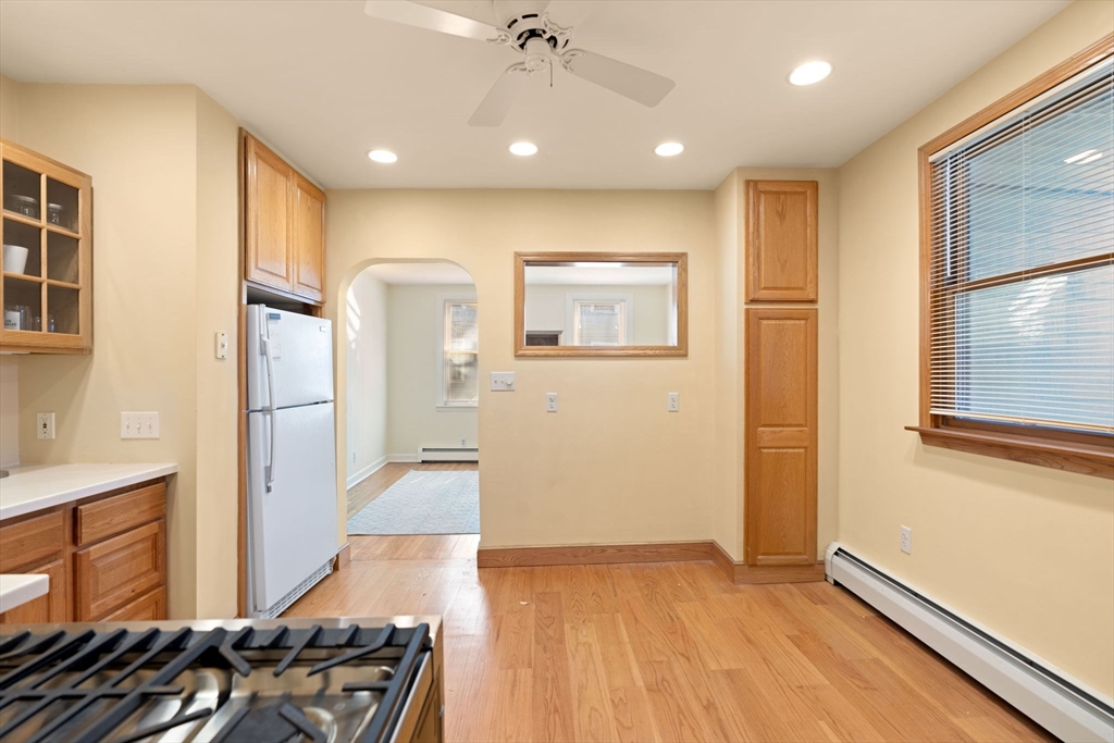 59 7th Street Cambridge, MA 02141 - Photo 15 of 26 a view of kitchen with furniture and wooden floor
