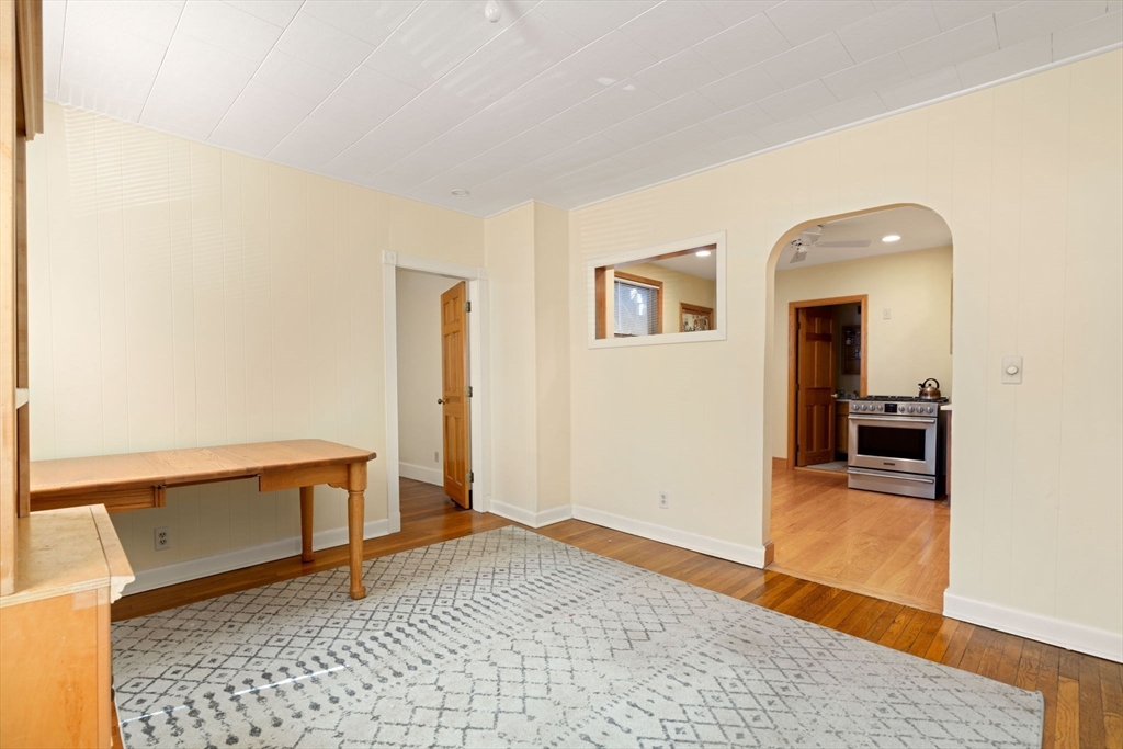 59 7th Street Cambridge, MA 02141 - Photo 18 of 26 a view of a livingroom with wooden furniture and a rug