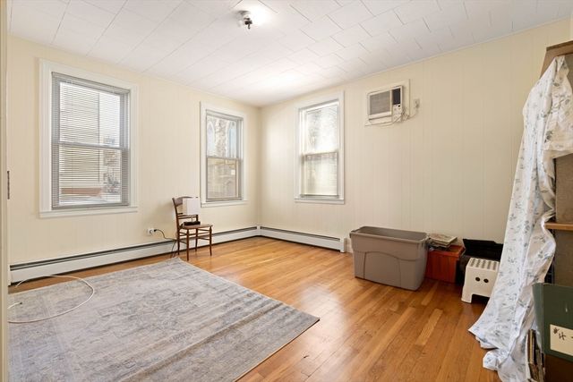 a living room with furniture rug and a window