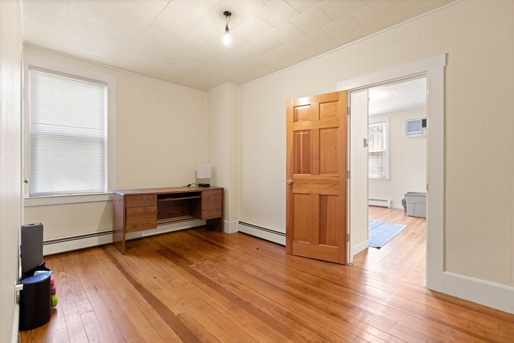 59 7th Street Cambridge, MA 02141 - Photo 21 of 26 wooden floor and windows in a room