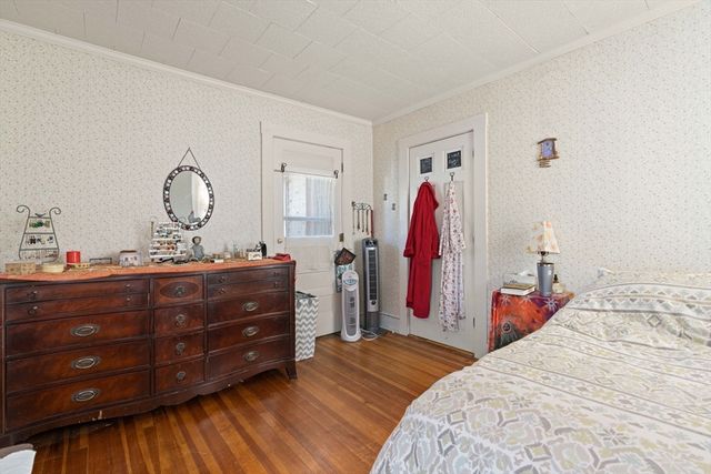 a bed room with a bed and a mirror