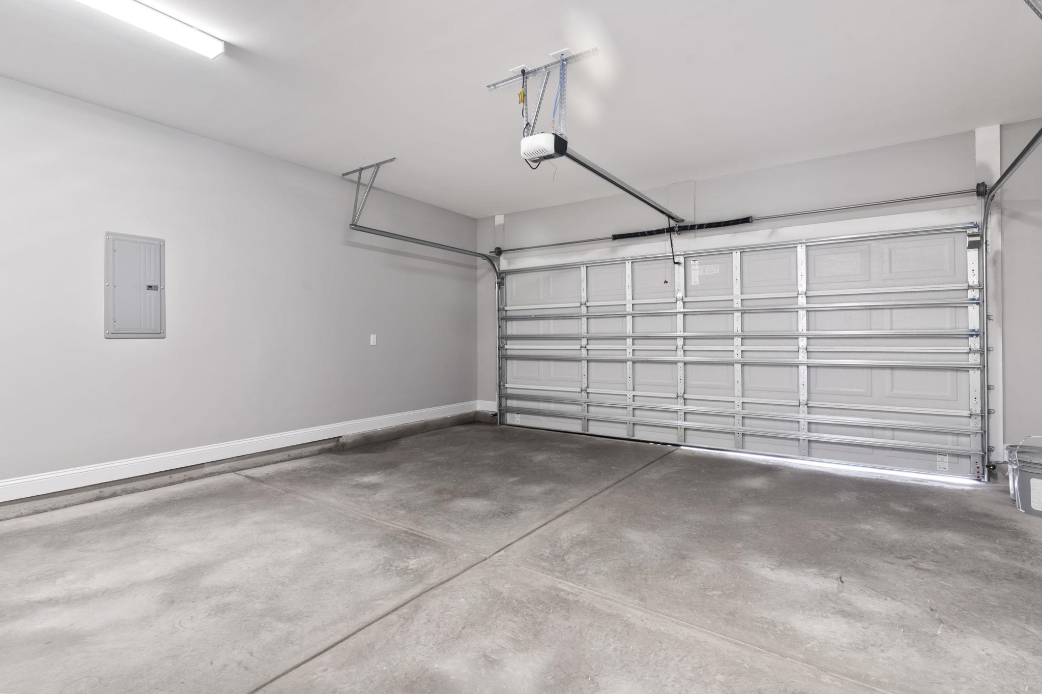 565 Timber Creek Drive Loris, SC 29569 - Photo 30 of 37 Garage featuring electric panel and baseboards