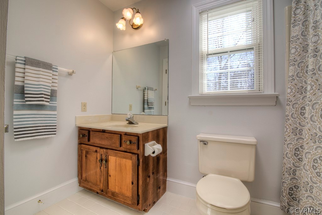 6321 Glebe Point Road Chesterfield, VA 23838 - Photo 17 of 23 a bathroom with a sink a toilet and a mirror