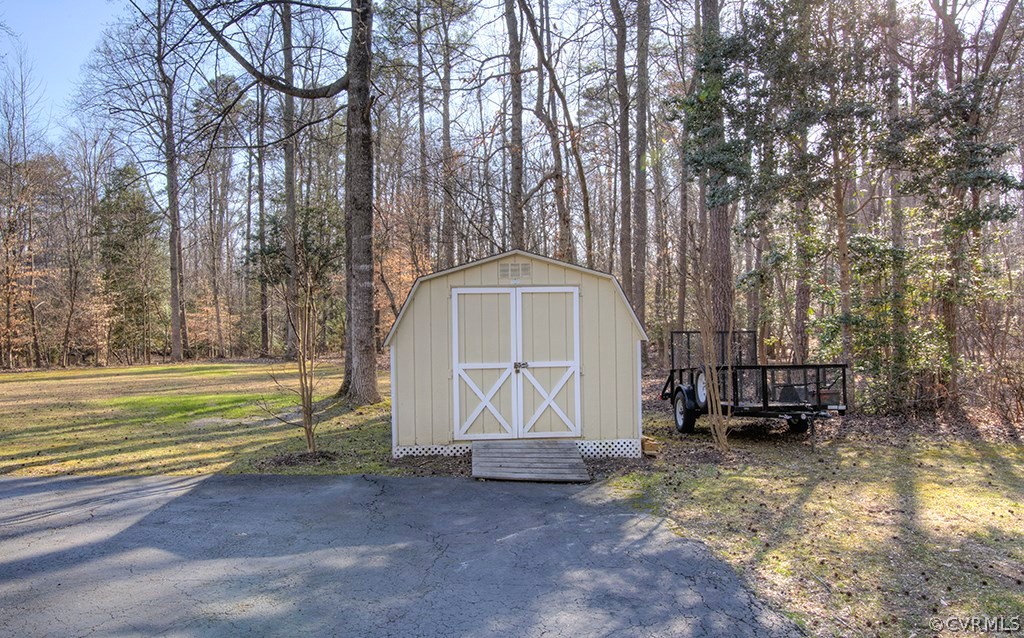 6321 Glebe Point Road Chesterfield, VA 23838 - Photo 20 of 23 a front view of a house with a garden