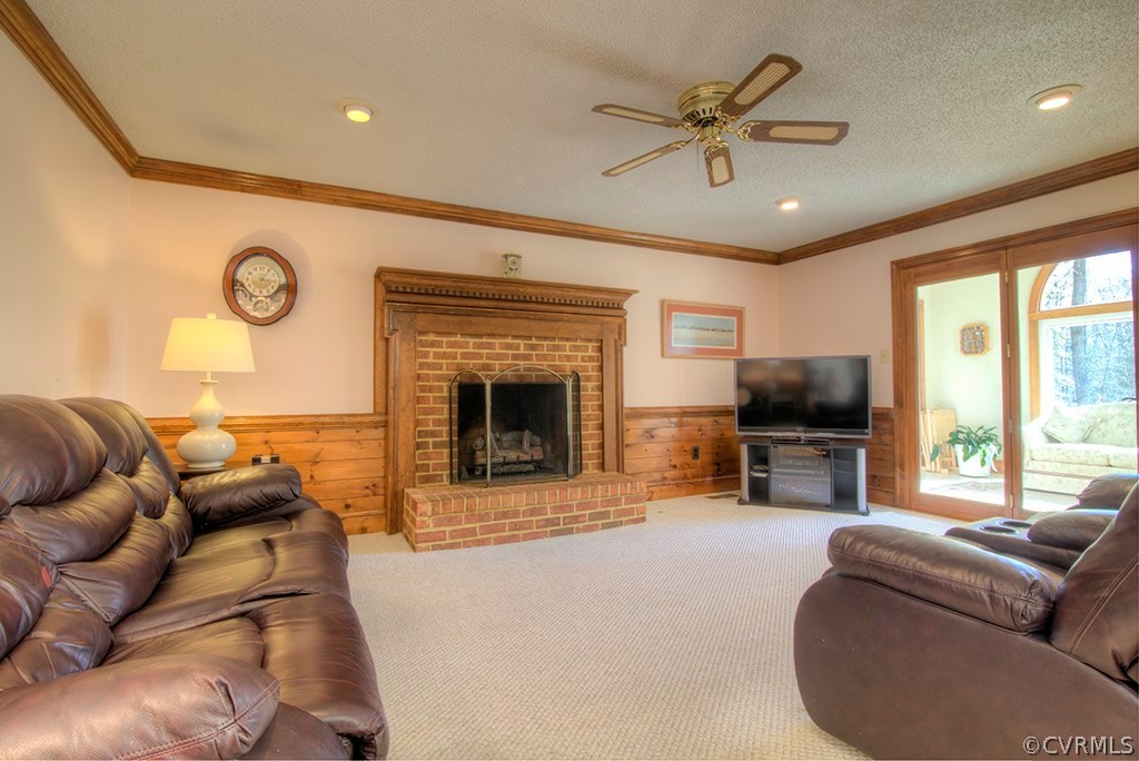 6321 Glebe Point Road Chesterfield, VA 23838 - Photo 4 of 23 a living room with furniture a fireplace and a flat screen tv