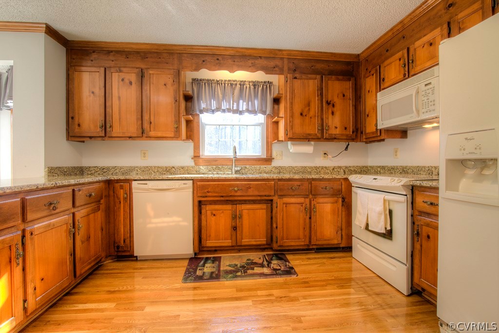 6321 Glebe Point Road Chesterfield, VA 23838 - Photo 8 of 23 a kitchen with stainless steel appliances granite countertop a stove a sink and a microwave