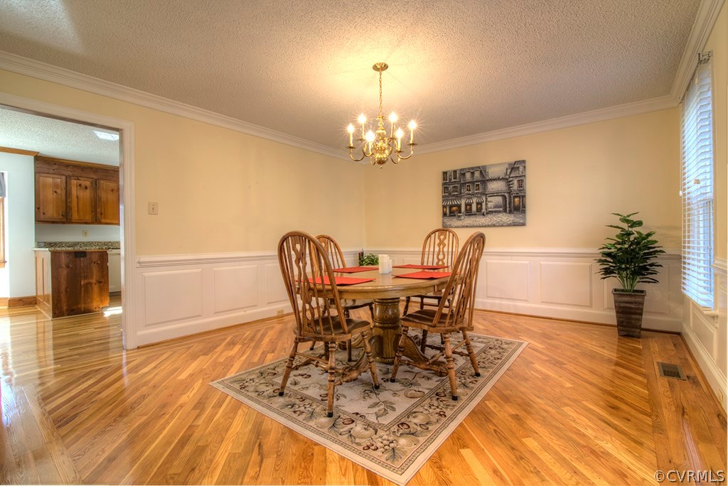 6321 Glebe Point Road Chesterfield, VA 23838 - Photo 10 of 23 a view of a dining room with furniture and wooden floor