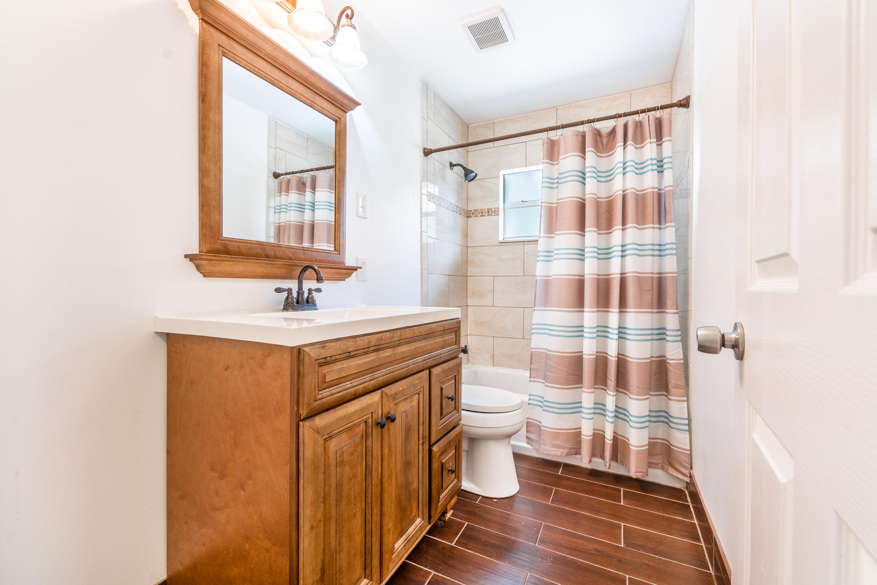 1219 South 10th Street Fort Pierce, FL 34950 - Photo 19 of 29 a bathroom with a sink toilet and shower