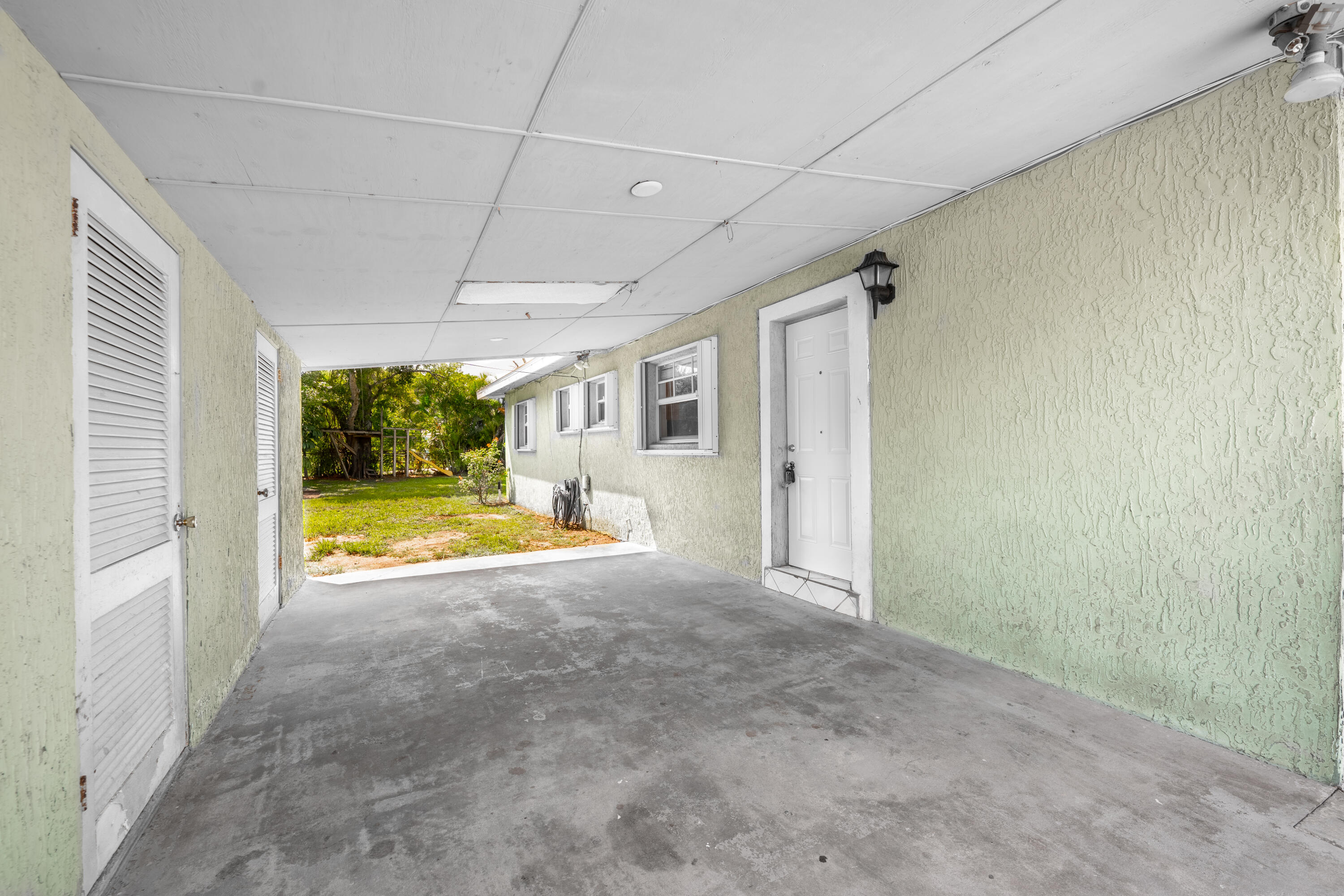 1219 South 10th Street Fort Pierce, FL 34950 - Photo 23 of 29 a view of an empty room with a fireplace and a large window