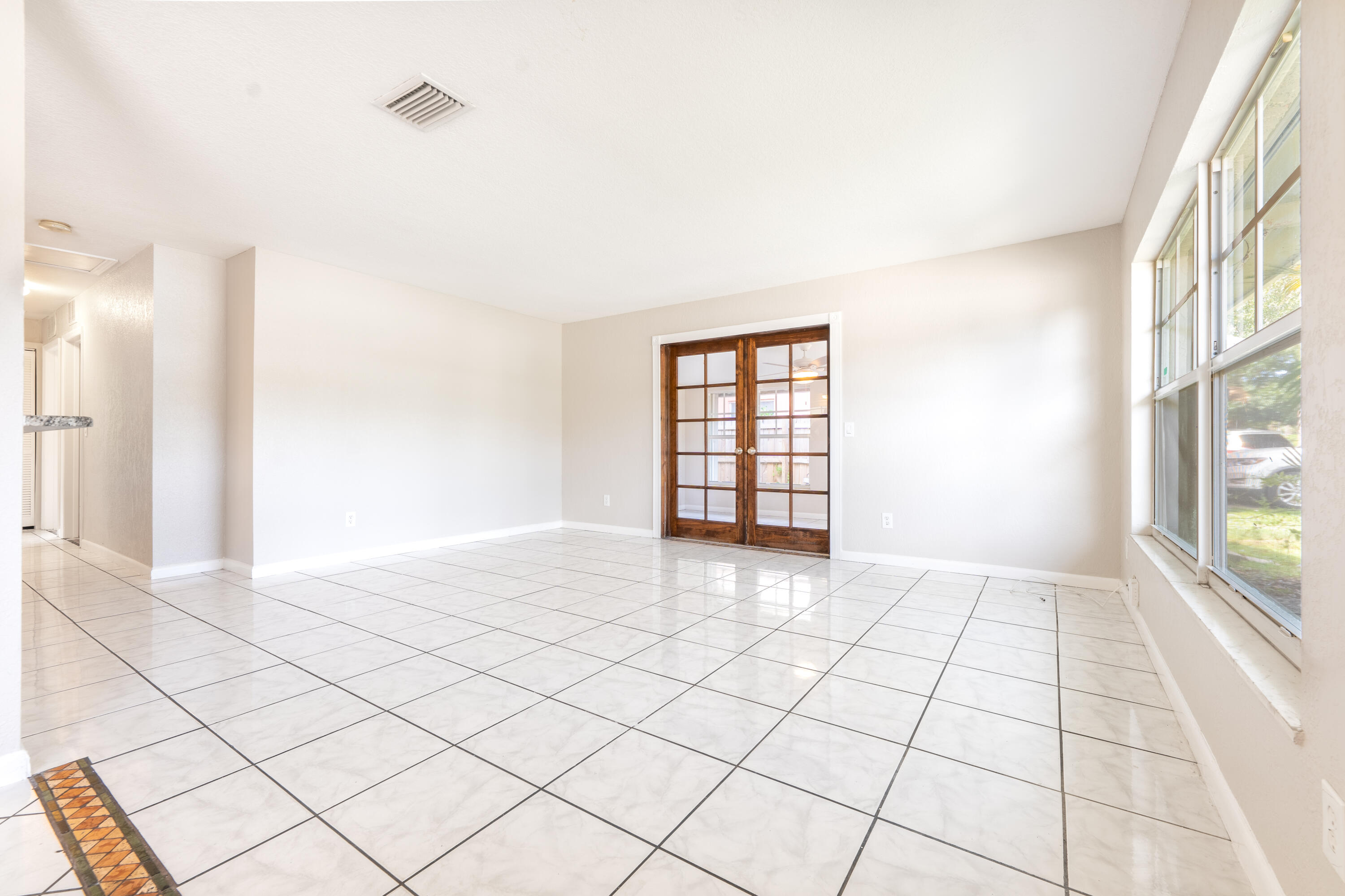 1219 South 10th Street Fort Pierce, FL 34950 - Photo 10 of 29 a view of an empty room and window