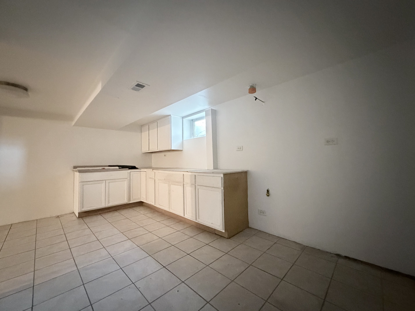 128 North York Road Bensenville, IL 60106 - Photo 22 of 39 a kitchen with a cabinets and white appliances