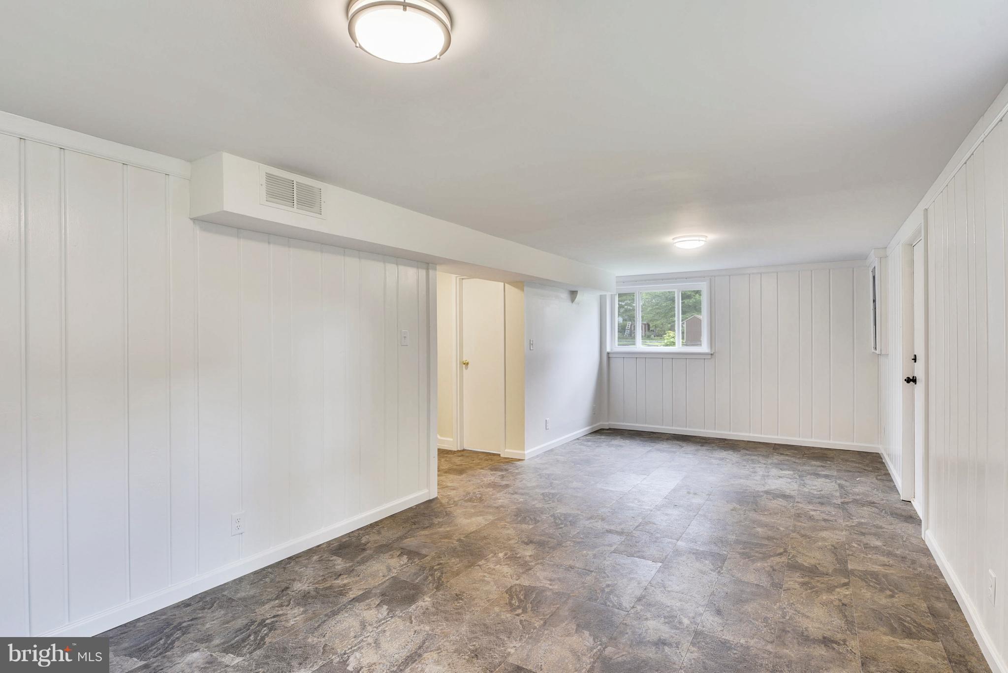 7303 Axton Street Springfield, VA 22151 - Photo 17 of 30 Rec room with new vinyl floor