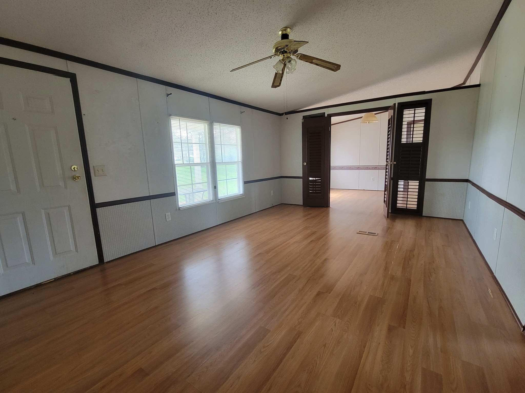 4949 Kedron Road Columbia, TN 38401 - Photo 4 of 16 a view of empty room with wooden floor and fan