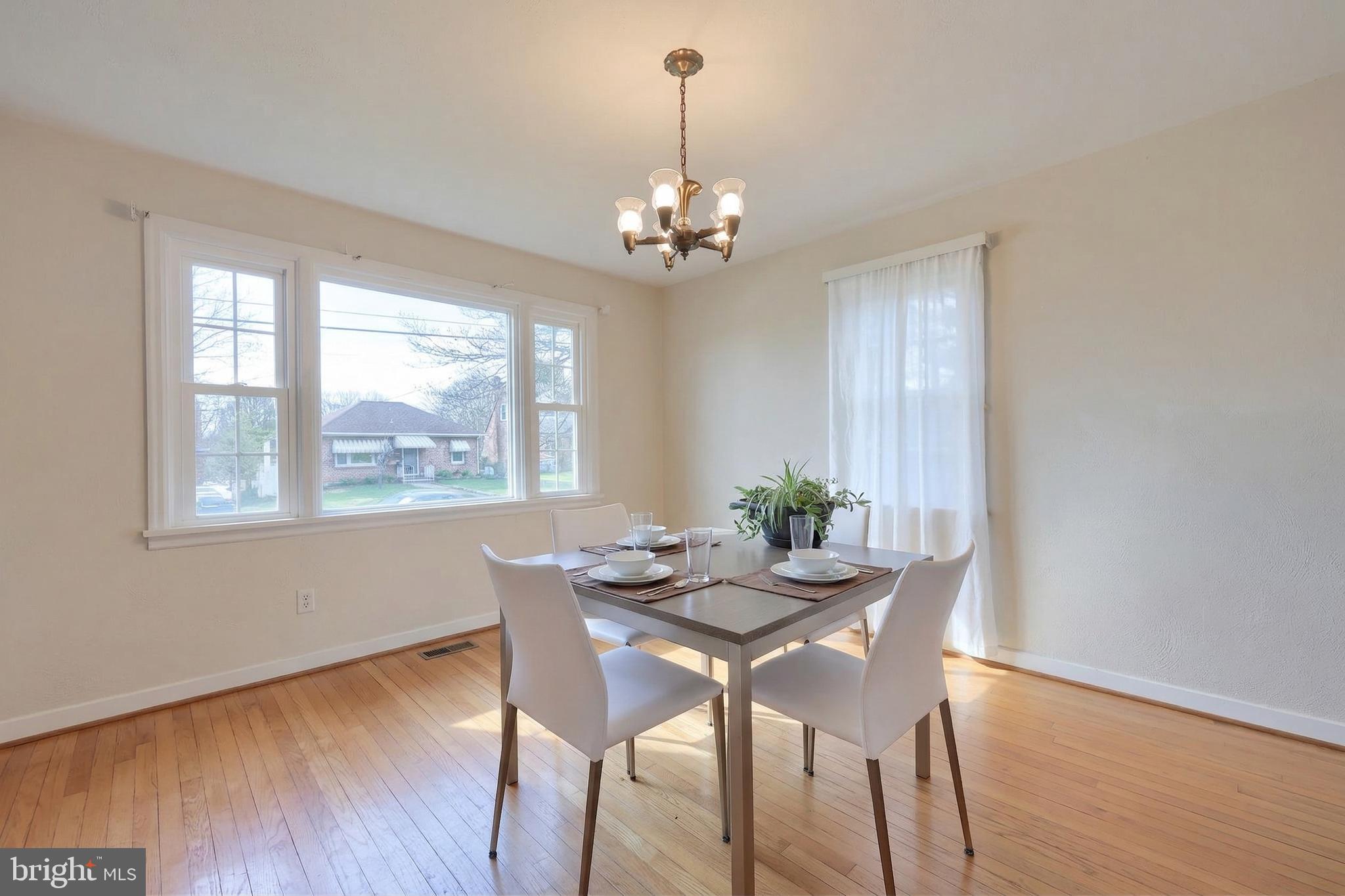 328 West Maple Street Dallastown, PA 17313 - Photo 13 of 37 a dining room with furniture a chandelier and wooden floor