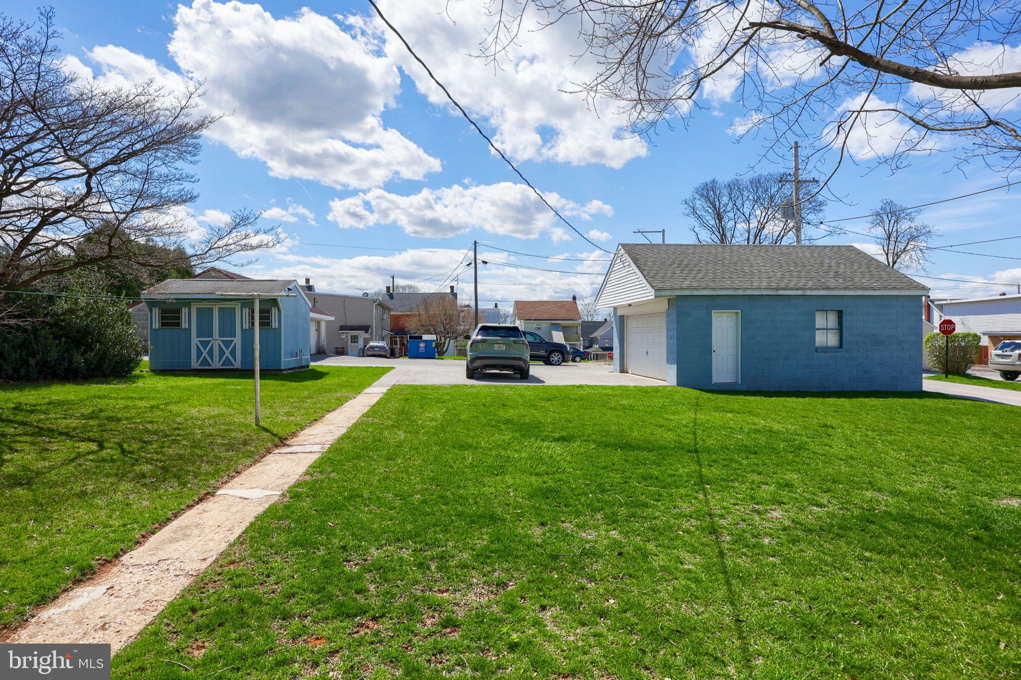 328 West Maple Street Dallastown, PA 17313 - Photo 2 of 37 a view of a house with a yard and a large tree