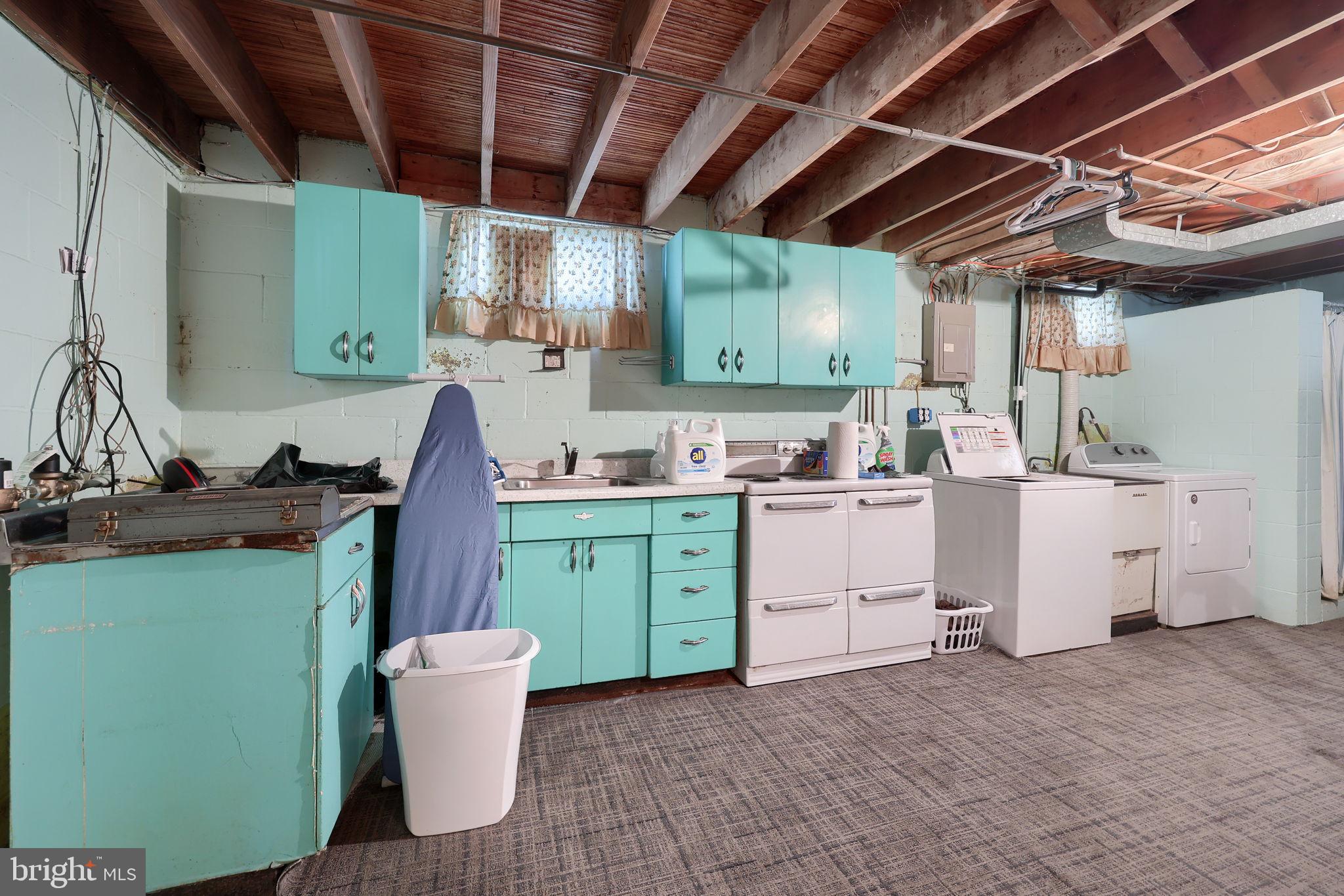 328 West Maple Street Dallastown, PA 17313 - Photo 22 of 37 a room with a sink cabinets and a window