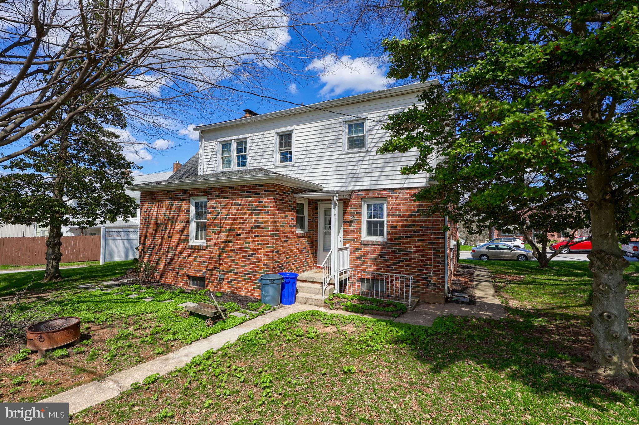 328 West Maple Street Dallastown, PA 17313 - Photo 25 of 37 a front view of a house with garden