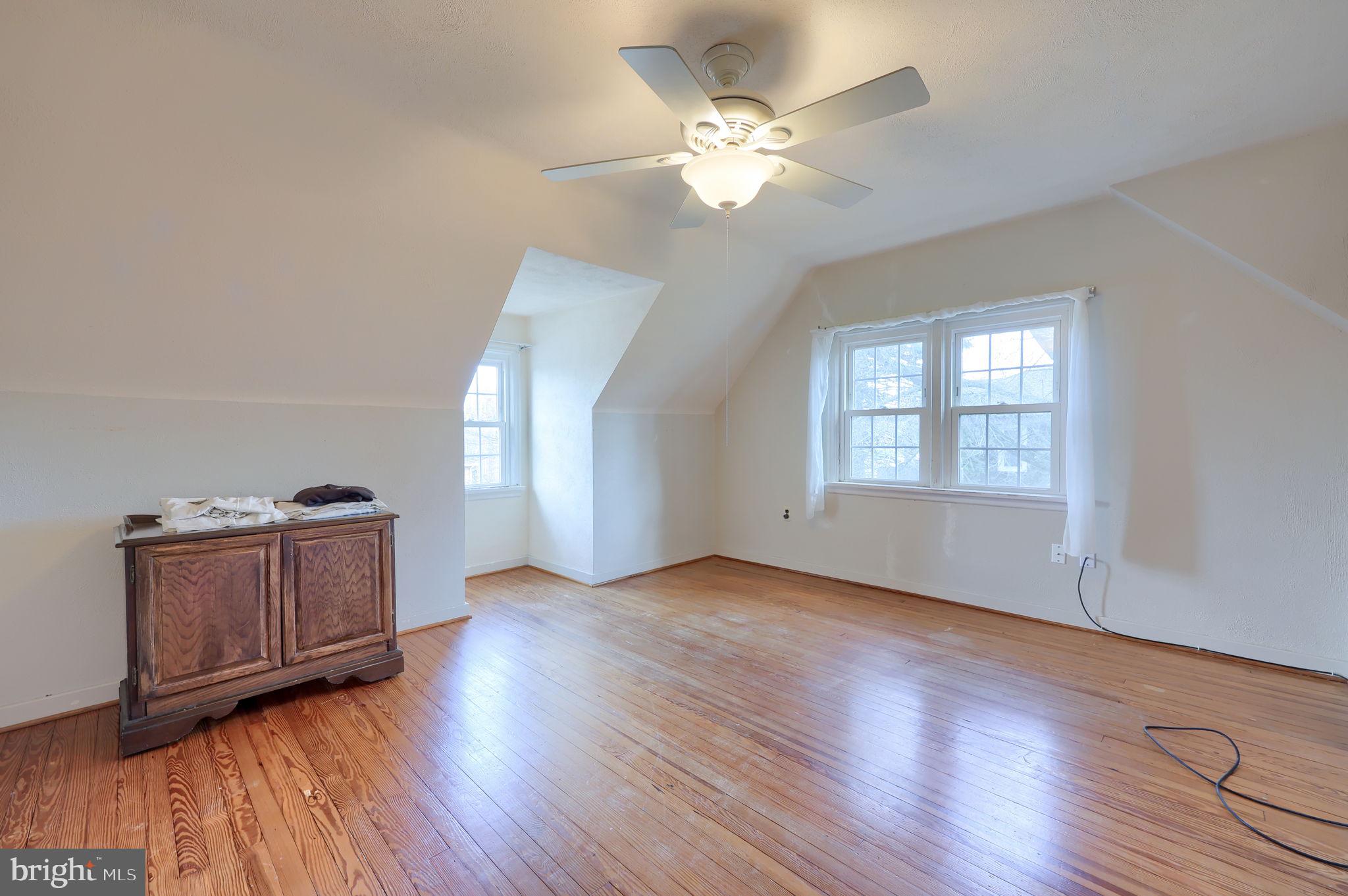 328 West Maple Street Dallastown, PA 17313 - Photo 9 of 37 an empty room with wooden floor and window