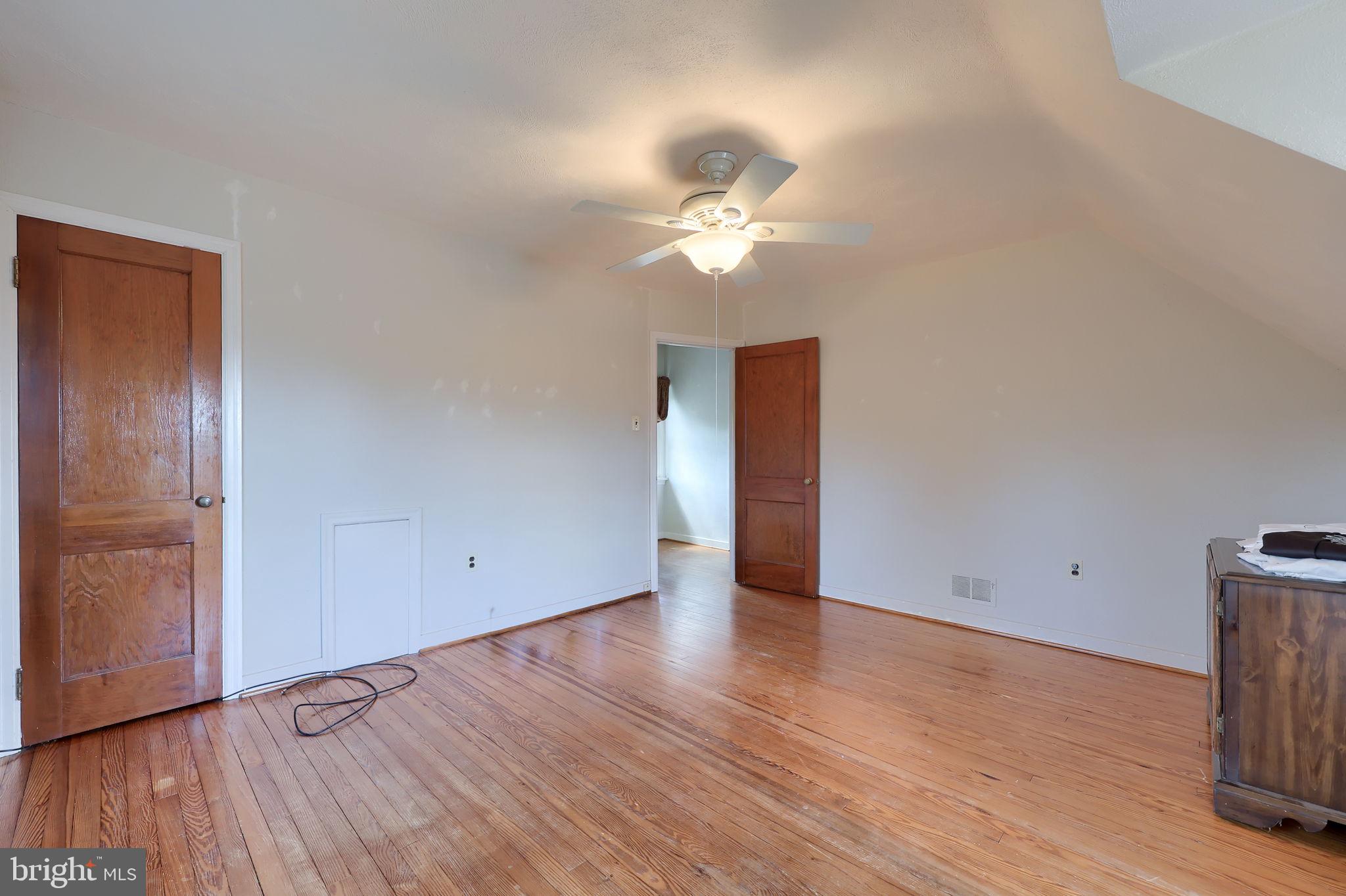 328 West Maple Street Dallastown, PA 17313 - Photo 10 of 37 a view of an empty room with wooden floor