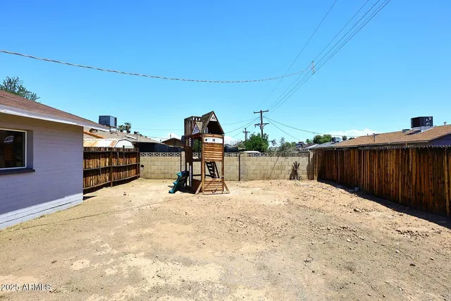 a view of a backyard of the house
