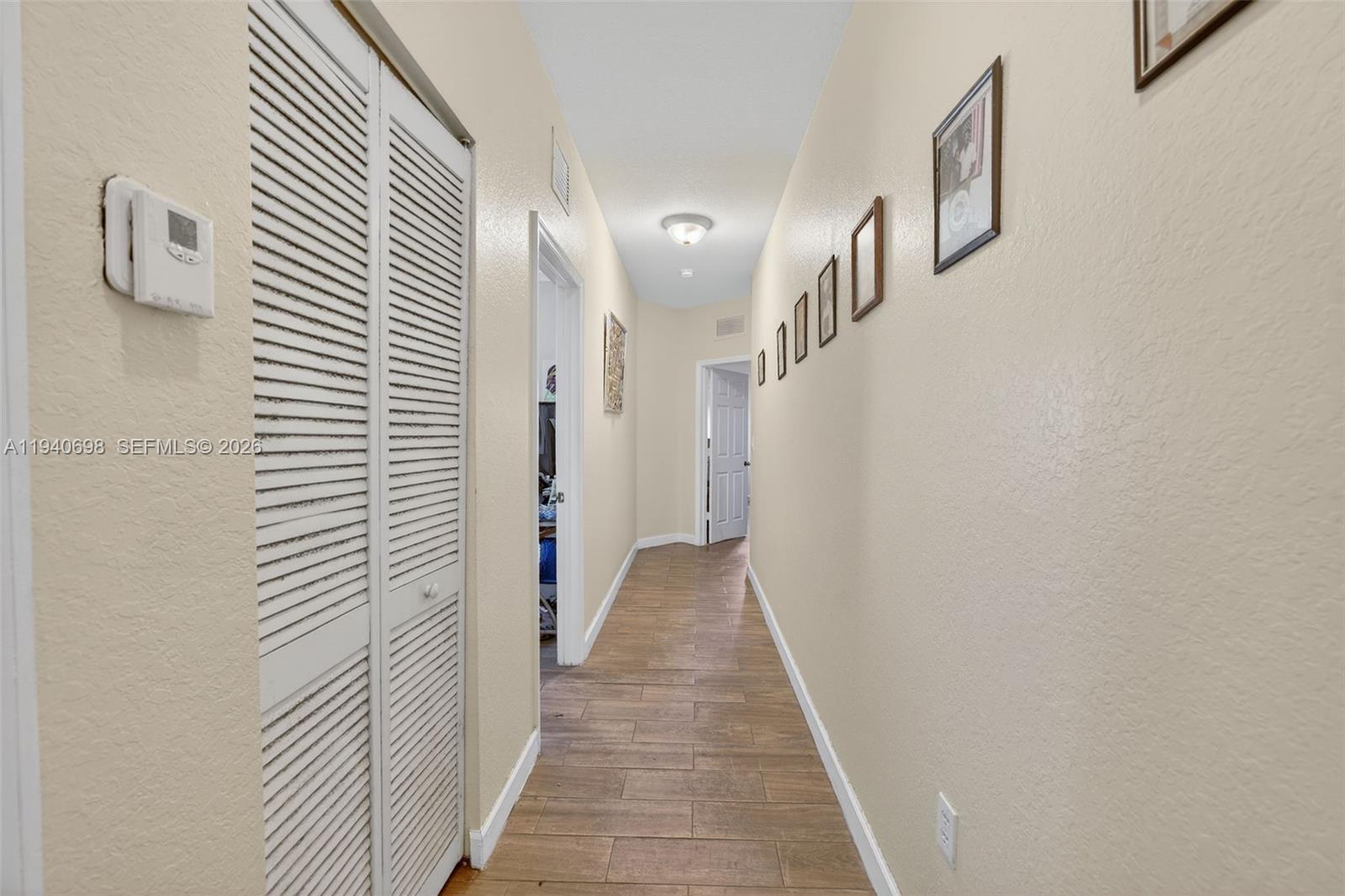 367 Northeast 36th Avenue Road Homestead, FL 33033 - Photo 21 of 36 a view of a hallway with a white door