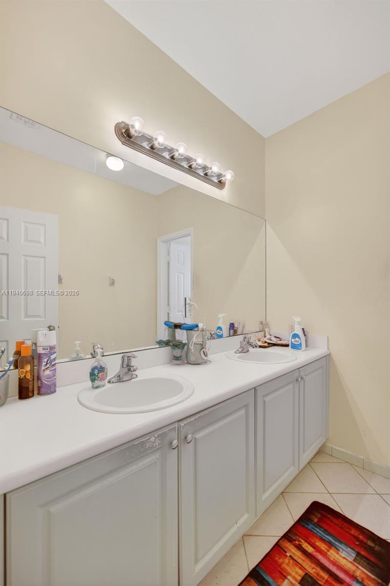 367 Northeast 36th Avenue Road Homestead, FL 33033 - Photo 26 of 36 a bathroom with a sink and a mirror