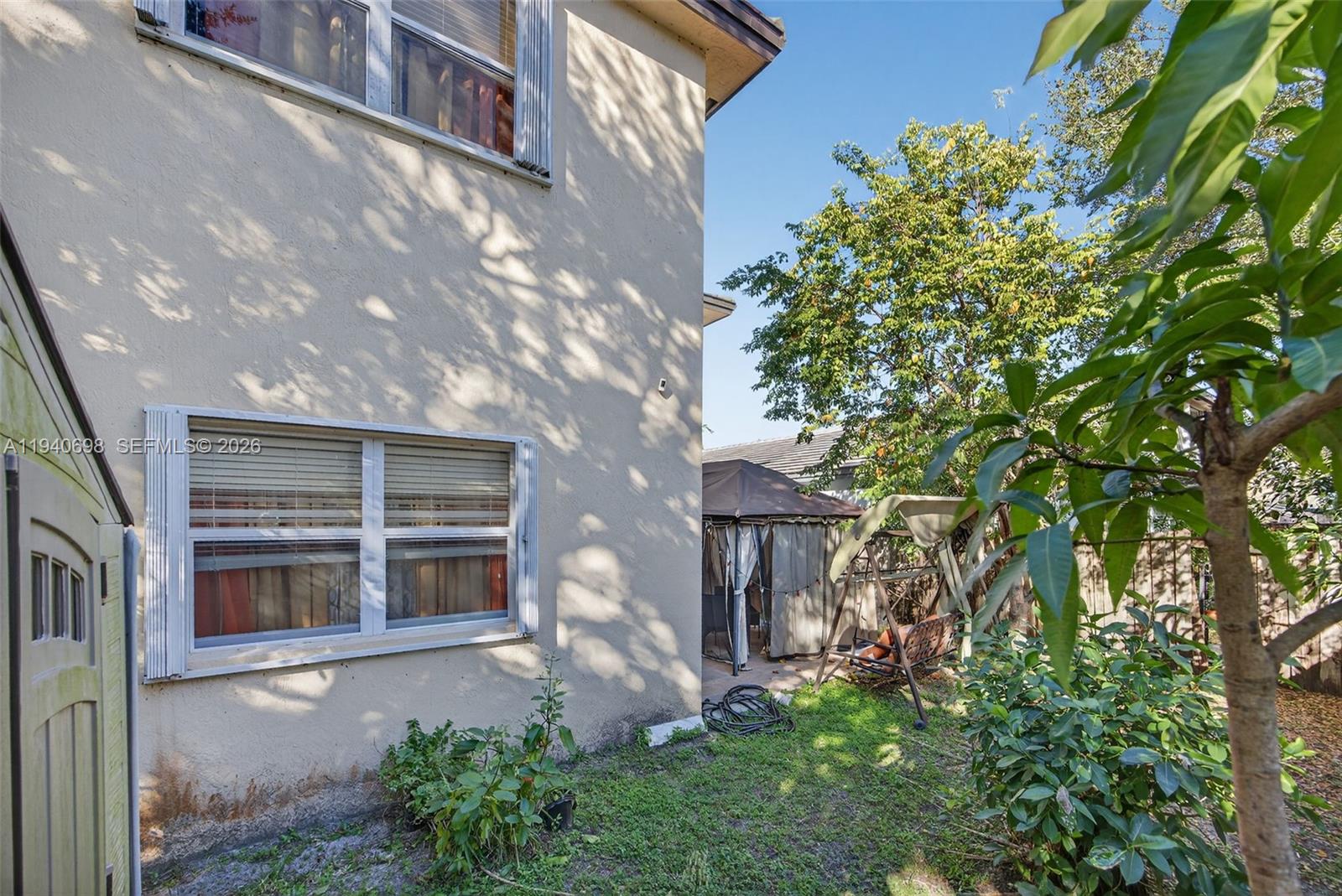 367 Northeast 36th Avenue Road Homestead, FL 33033 - Photo 33 of 36 a front view of a house with a yard