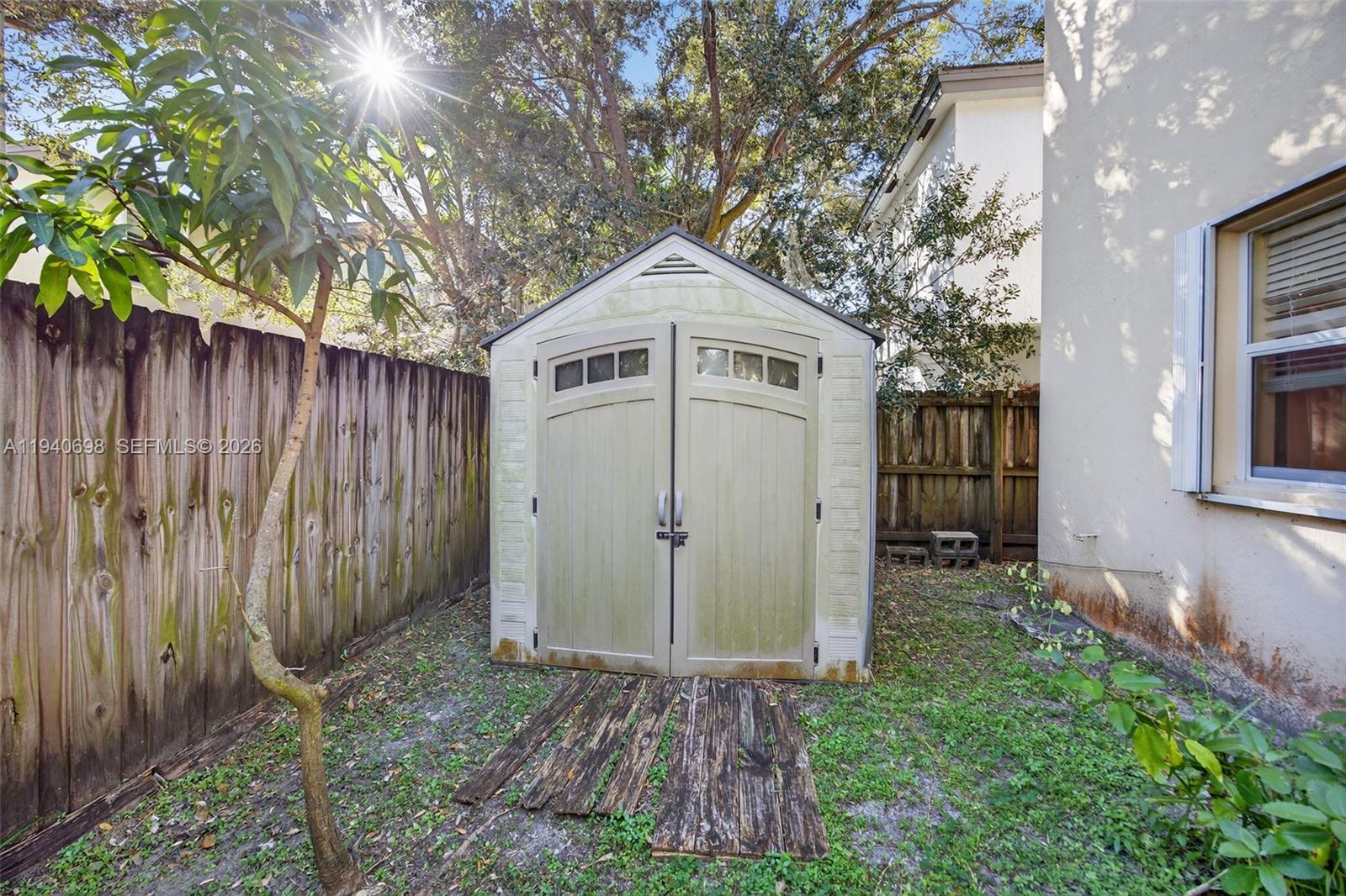 367 Northeast 36th Avenue Road Homestead, FL 33033 - Photo 34 of 36 a front view of a house with garden