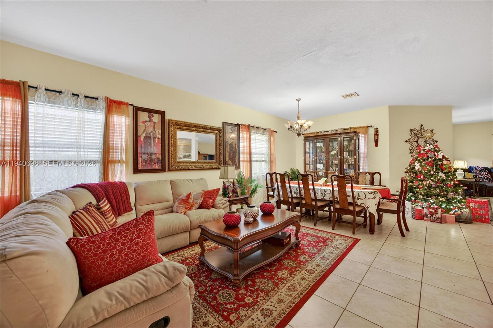 367 Northeast 36th Avenue Road Homestead, FL 33033 - Photo 5 of 36 a living room with furniture and flowers