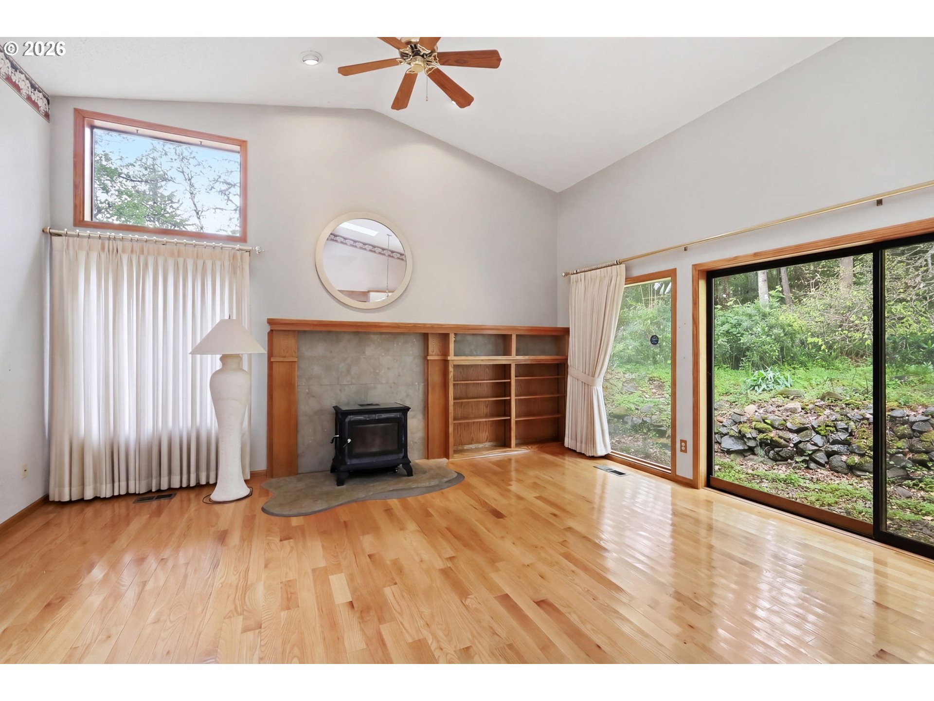 2983 Timberline Drive Eugene, OR 97405 - Photo 5 of 31 a view of empty room with wooden floor and fireplace
